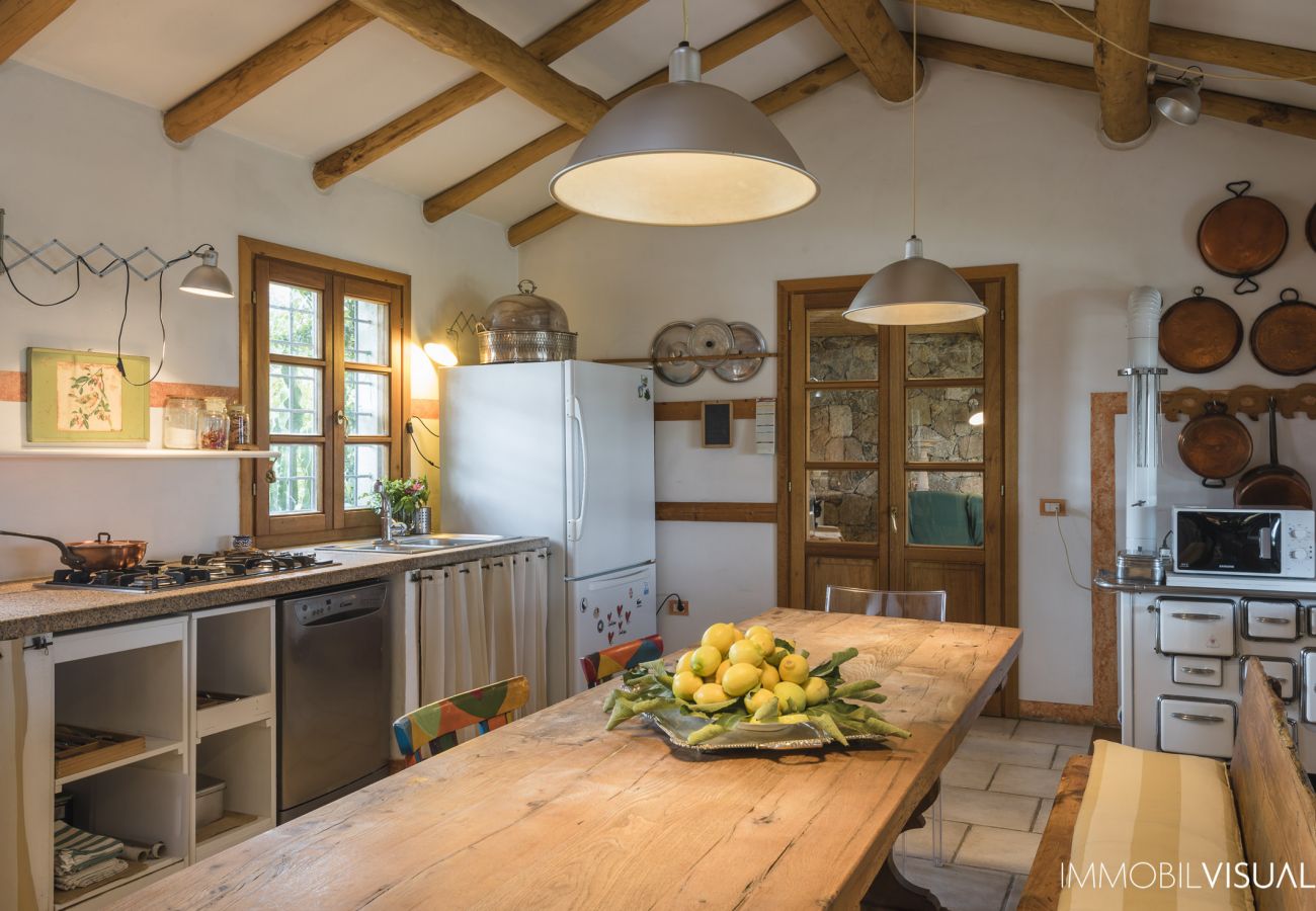  Villa Relais - open space with exposed beams and designer furnishings in Golfo Aranci