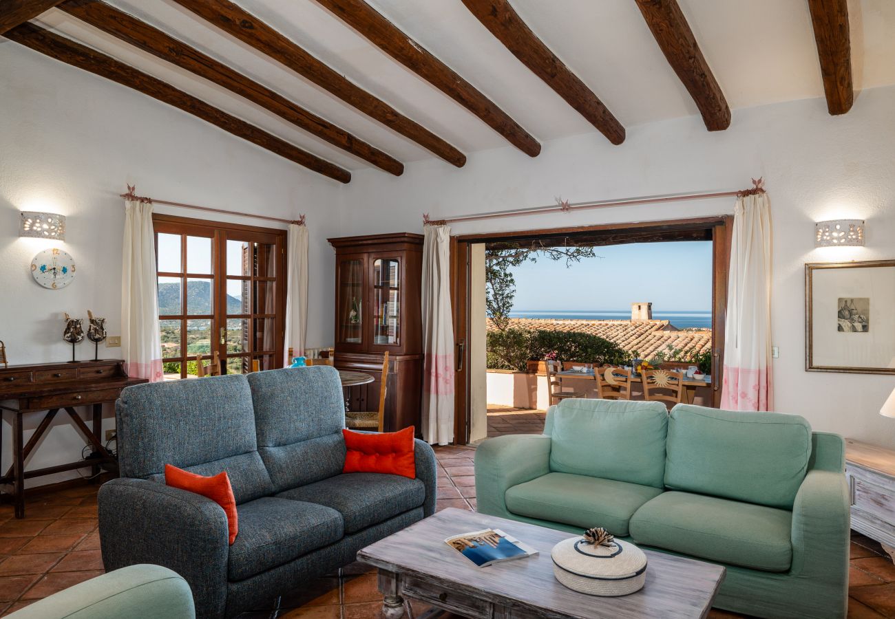 Villa Kiki - cozy living room with beam ceilings, Klodge rental villa on the northern coast of Sardinia