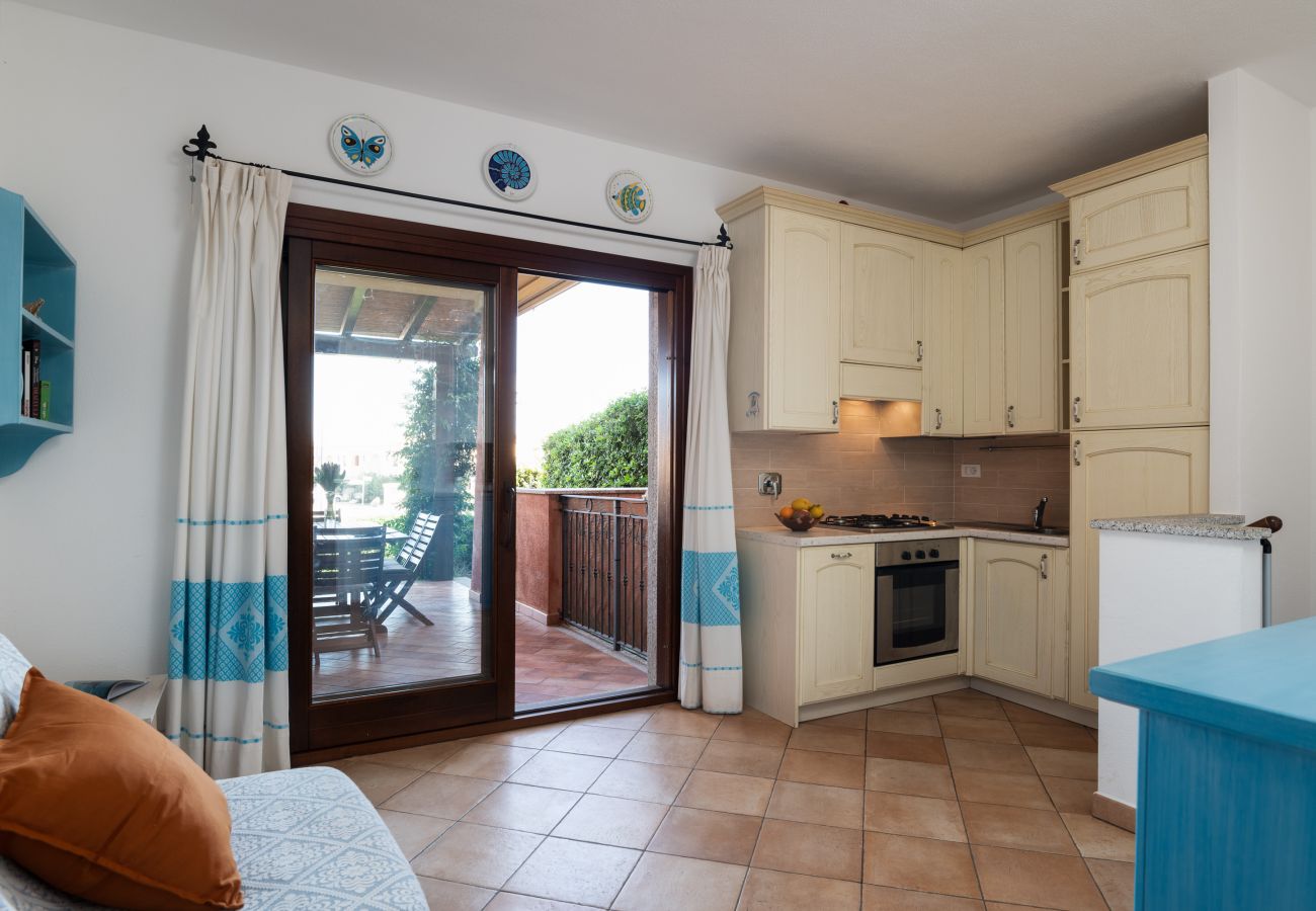 Myrsine 9D - Living room with kitchenette and garden view, holiday home in Sardinia