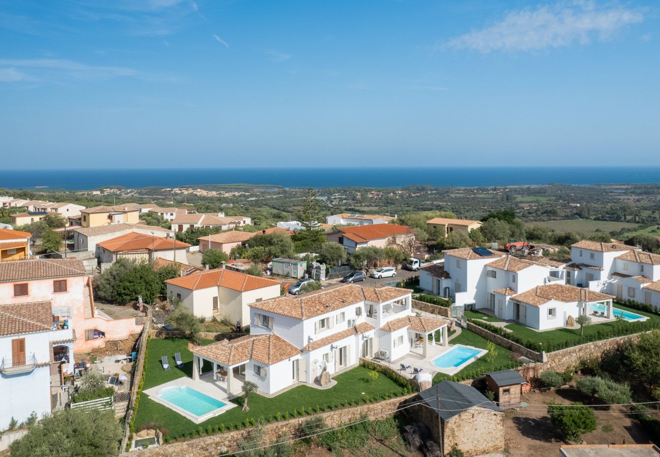 Bellevue 36C - aerial view of villa with private pool and sea in the background