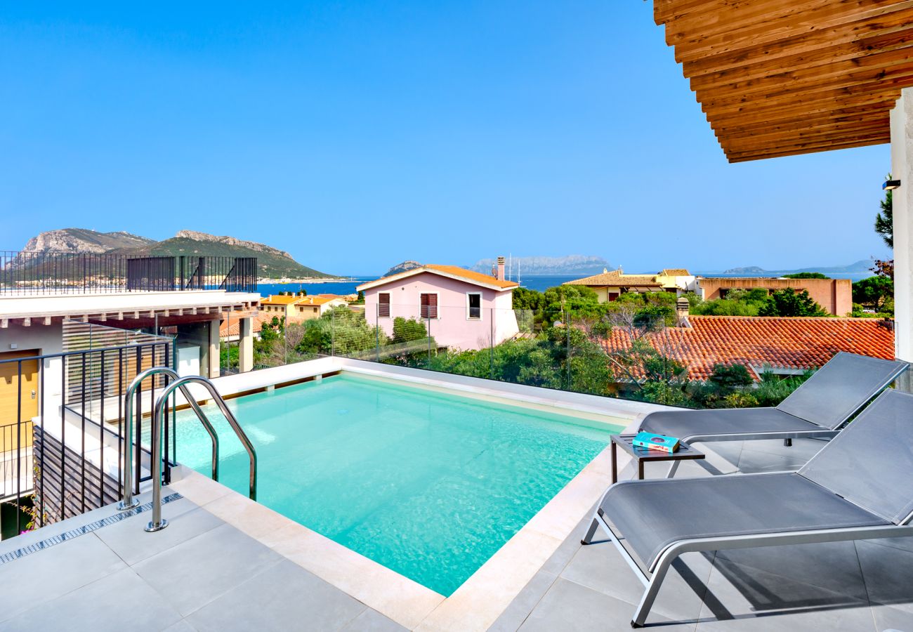 Villa Mathis - view of Golfo Aranci town, villa with pool nestled in the urban landscape